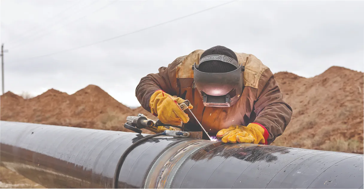 A daughter embracing her mother, both smiling.
